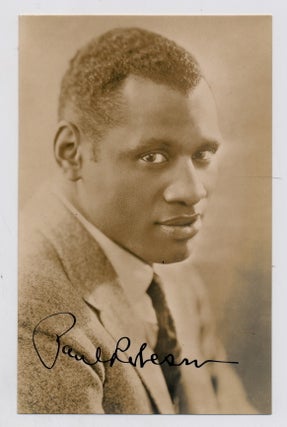 Item #4618 Photograph SIGNED, bust length, sepia toned, post card size, docketed 1933. PAUL ROBESON
