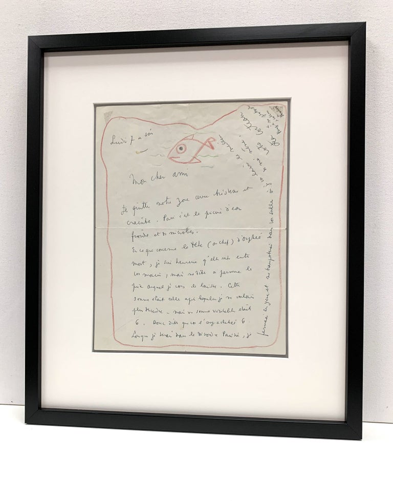 Item #4652 Intriguing drawing SIGNED of a fish swimming within the red border of a letter. Cocteau writes about the price of a drawing "concerning the head of dead Orpheus." and alludes to his photographs of Arthur Rimbaud. JEAN COCTEAU.